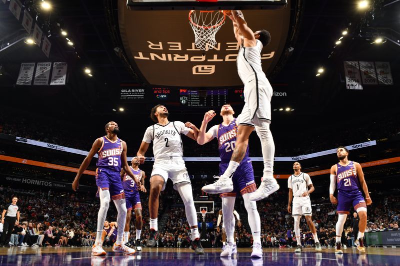 PHOENIX, AZ - NOVEMBER 27: Ben Simmons #10 of the Brooklyn Nets dunks the ball during the game against the Phoenix Suns on November 27, 2024 at Footprint Center in Phoenix, Arizona. NOTE TO USER: User expressly acknowledges and agrees that, by downloading and or using this photograph, user is consenting to the terms and conditions of the Getty Images License Agreement. Mandatory Copyright Notice: Copyright 2024 NBAE (Photo by Barry Gossage/NBAE via Getty Images)