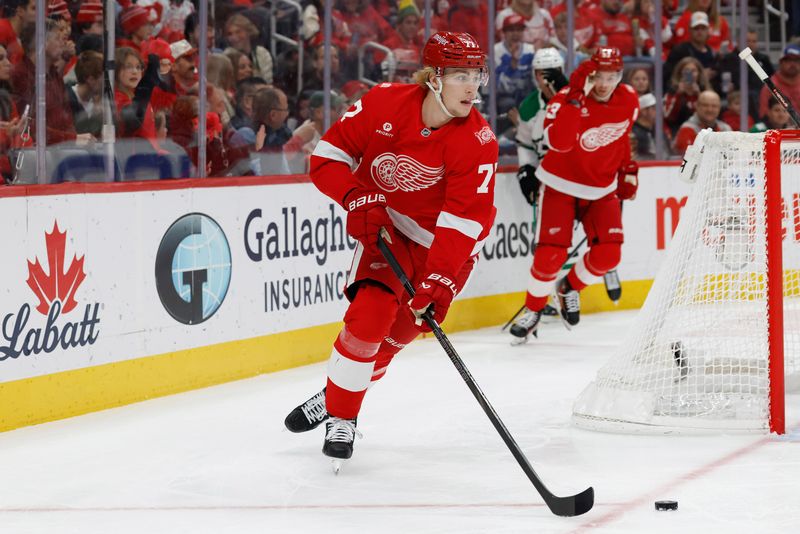 Dec 23, 2025; Detroit, Michigan, USA;  Detroit Red Wings defenseman Simon Edvinsson (77) skates with the puck in the first period against the Dallas Stars at Little Caesars Arena. Mandatory Credit: Rick Osentoski-Imagn Images