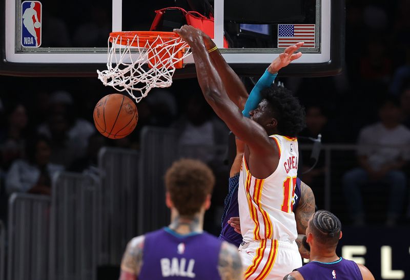 ATLANTA, GEORGIA - OCTOBER 25:  Clint Capela #15 of the Atlanta Hawks dunks against Nick Richards #4 of the Charlotte Hornets during the second quarter at State Farm Arena on October 25, 2024 in Atlanta, Georgia.  NOTE TO USER: User expressly acknowledges and agrees that, by downloading and/or using this photograph, user is consenting to the terms and conditions of the Getty Images License Agreement.  (Photo by Kevin C. Cox/Getty Images)