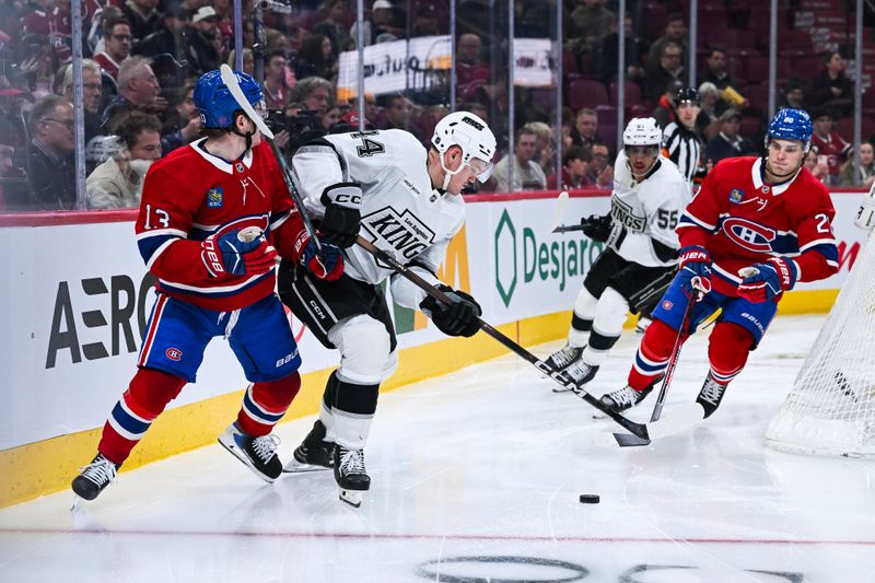 Nov 11, 2025; Montreal, Quebec, CAN; Los Angeles Kings defenseman Mikey Anderson (44) defends the puck against Montreal Canadiens right wing Cole Caufield (13) during the third period at Bell Centre. Mandatory Credit: David Kirouac-Imagn Images