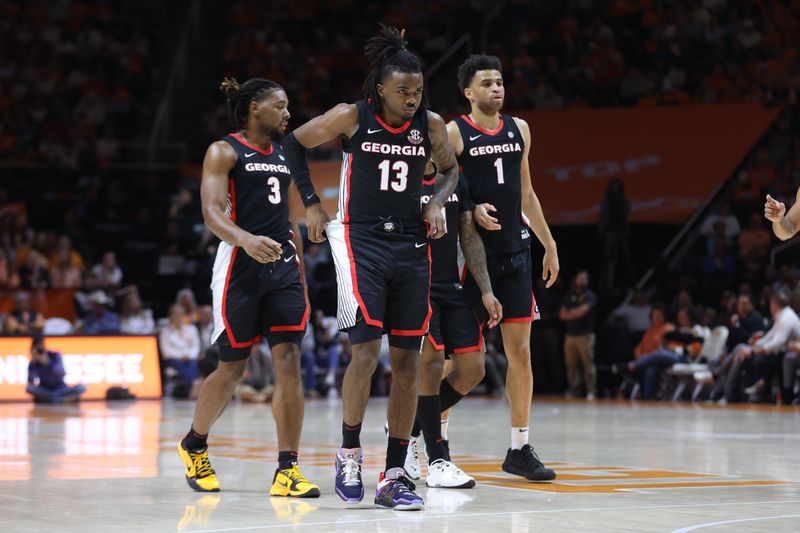Jan 25, 2023; Knoxville, Tennessee, USA; Georgia Bulldogs guard Kario Oquendo (3) and guard Mardrez McBride (13) and guard Jabri Abdur-Rahim (1) during the second half against the Tennessee Volunteers at Thompson-Boling Arena. Mandatory Credit: Randy Sartin-USA TODAY Sports