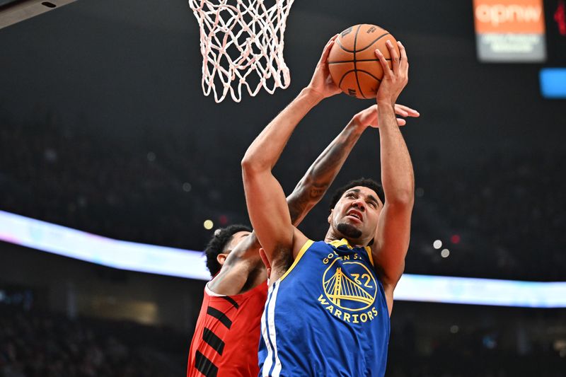 PORTLAND, OREGON - OCTOBER 23: Trayce Jackson-Davis #32 of the Golden State Warriors drives to the basket against the Portland Trail Blazers during the first quarter at Moda Center on October 23, 2024 in Portland, Oregon. NOTE TO USER: User expressly acknowledges and agrees that, by downloading and or using this photograph, User is consenting to the terms and conditions of the Getty Images License Agreement. (Photo by Alika Jenner/Getty Images)