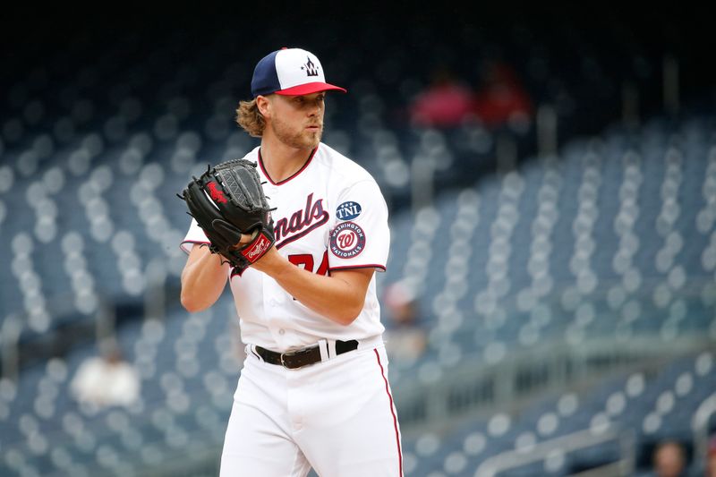 Jun 22, 2023; Washington, District of Columbia, USA; Washington Nationals starting pitcher Jake Irvin (74) prepares to throw the ball against the Arizona Diamondbacks in the first inning at Nationals Park. Mandatory Credit: Amber Searls-USA TODAY Sports