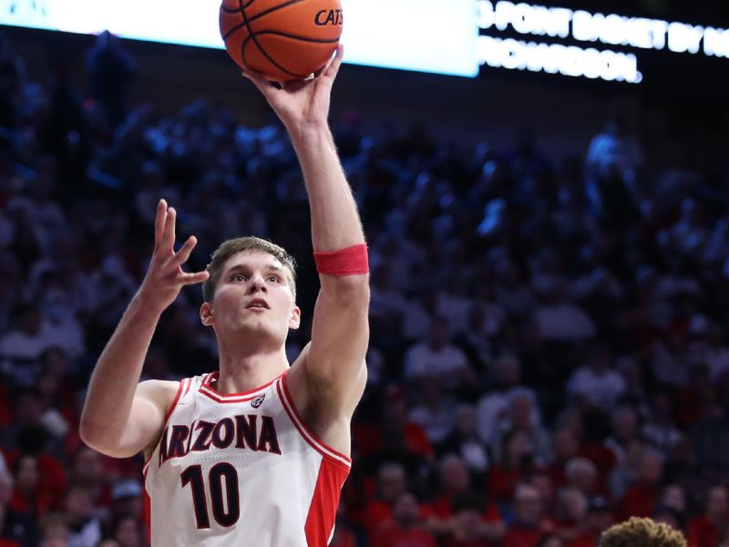 Feb 2, 2023; Tucson, Arizona, USA; Arizona Wildcats forward Azuolas Tubelis (10) makes a basket against Oregon Ducks guard Keeshawn Barthelemy (3)  in the second half at McKale Center. Mandatory Credit: Zachary BonDurant-USA TODAY Sports