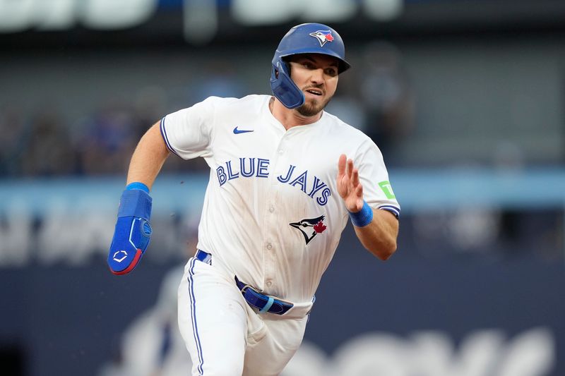 Jul 26, 2024; Toronto, Ontario, CAN; Toronto Blue Jays second baseman Spencer Horwitz (48) heads for home on a double hit by third baseman Ernie Clement (not pictured) during first inning against the Texas Rangers at Rogers Centre. Mandatory Credit: John E. Sokolowski-USA TODAY Sports