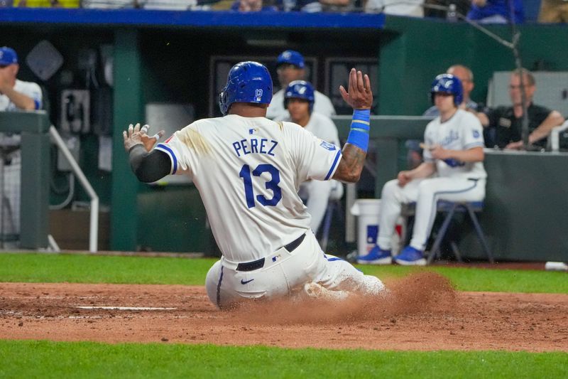 Jun 10, 2024; Kansas City, Missouri, USA; Kansas City Royals first baseman Salvador Perez (13) scores against the New York Yankees in the eighth inning at Kauffman Stadium. Mandatory Credit: Denny Medley-USA TODAY Sports