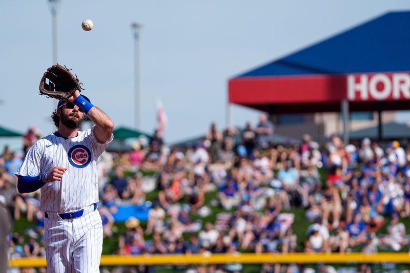 Feb 25, 2024; Mesa, Arizona, USA; Chicago Cubs infielder Dansby Swanson (7) reaches out to catch a ball in the sixth inning during a spring training game at Sloan Park against the San Diego Padres. Mandatory Credit: Allan Henry-USA TODAY Sports