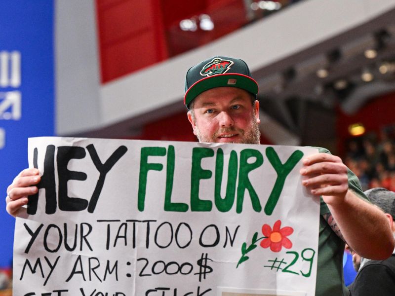 Nov 18, 2023; Stockholm, SWE; Fans of the Minnesota Wild hold a sign against the Ottawa Senators during a Global Series NHL hockey game at Avicii Arena. Mandatory Credit: Per Haljestam-USA TODAY Sports