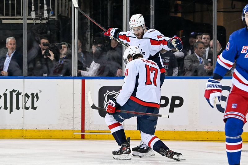 Apr 23, 2024; New York, New York, USA;  Washington Capitals right wing Tom Wilson (43) celebrates the goal Washington Capitals center Dylan Strome (17) against the New York Rangers during the second period in game two of the first round of the 2024 Stanley Cup Playoffs at Madison Square Garden. Mandatory Credit: Dennis Schneidler-USA TODAY Sports