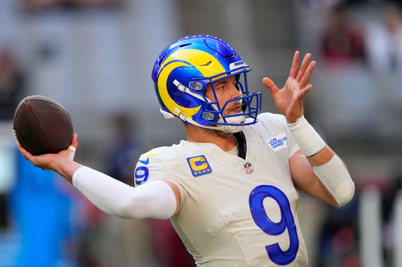 Los Angeles Rams quarterback Matthew Stafford warms up before an NFL football game against the Arizona Cardinals, Sunday, Nov. 26, 2023, in Glendale, Ariz. (AP Photo/Matt York)