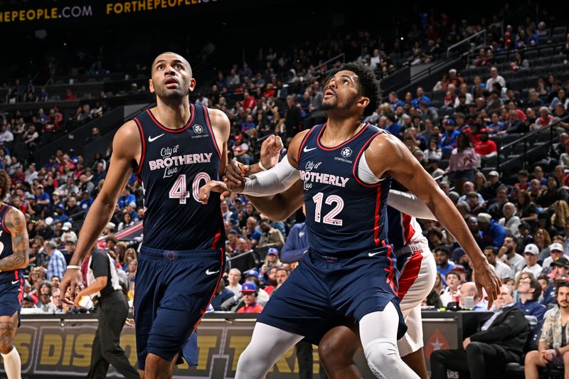 PHILADELPHIA, PA - APRIL 9: Nicolas Batum #40 and Tobias Harris #12 of the Philadelphia 76ers wait for a rebound during the game against the Detroit Pistons on April 9, 2024 at the Wells Fargo Center in Philadelphia, Pennsylvania NOTE TO USER: User expressly acknowledges and agrees that, by downloading and/or using this Photograph, user is consenting to the terms and conditions of the Getty Images License Agreement. Mandatory Copyright Notice: Copyright 2024 NBAE (Photo by David Dow/NBAE via Getty Images)