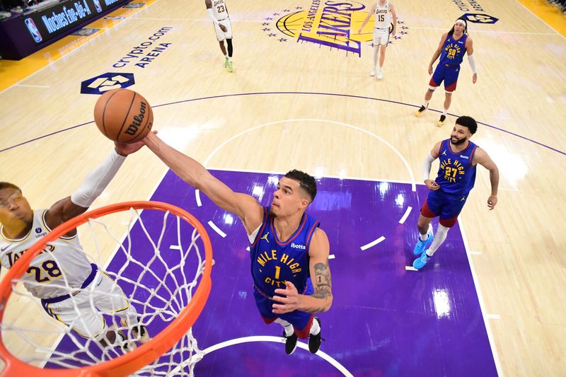 LOS ANGELES, CA - MARCH 2: Michael Porter Jr. #1 of the Denver Nuggets rebounds the ball during the game against the Los Angeles Lakers on March 2, 2024 at Crypto.Com Arena in Los Angeles, California. NOTE TO USER: User expressly acknowledges and agrees that, by downloading and/or using this Photograph, user is consenting to the terms and conditions of the Getty Images License Agreement. Mandatory Copyright Notice: Copyright 2024 NBAE (Photo by Adam Pantozzi/NBAE via Getty Images)