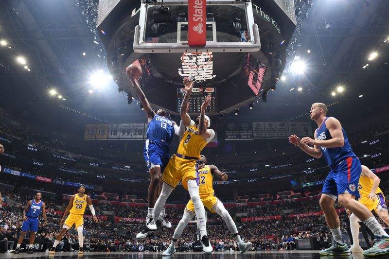 LOS ANGELES, CA - JANUARY 23:  Paul George #13 of the LA Clippers goes to the basket during the game on January 23, 2024 at Crypto.Com Arena in Los Angeles, California. NOTE TO USER: User expressly acknowledges and agrees that, by downloading and/or using this Photograph, user is consenting to the terms and conditions of the Getty Images License Agreement. Mandatory Copyright Notice: Copyright 2024 NBAE (Photo by Adam Pantozzi/NBAE via Getty Images)