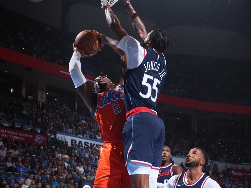 OKLAHOMA CITY, OK - NOVEMBER 11: Luguentz Dort #5 of the Oklahoma City Thunder drives to the basket during the game against the LA Clippers on November 11, 2024 at Paycom Center in Oklahoma City, Oklahoma. NOTE TO USER: User expressly acknowledges and agrees that, by downloading and or using this photograph, User is consenting to the terms and conditions of the Getty Images License Agreement. Mandatory Copyright Notice: Copyright 2024 NBAE (Photo by Nathaniel S. Butler/NBAE via Getty Images)