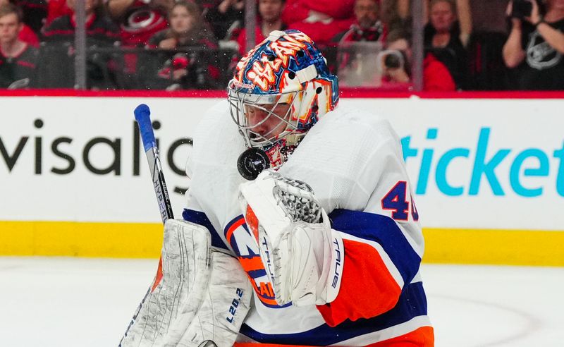 Apr 20, 2024; Raleigh, North Carolina, USA; New York Islanders goaltender Semyon Varlamov (40) makes a save against the Carolina Hurricanes during the third period in game one of the first round of the 2024 Stanley Cup Playoffs at PNC Arena. Mandatory Credit: James Guillory-USA TODAY Sports