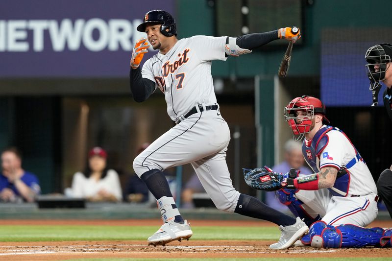 Jun 27, 2023; Arlington, Texas, USA; Detroit Tigers third baseman Jonathan Schoop (7) follows through on his single against the Texas Rangers during the second inning at Globe Life Field. Mandatory Credit: Jim Cowsert-USA TODAY Sports