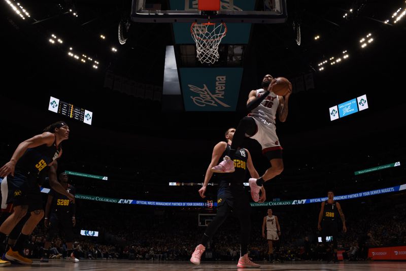 DENVER, CO - FEBRUARY 29: Caleb Martin #16 of the Miami Heat drives to the basket during the game against the Denver Nuggets on February 29, 2024 at the Ball Arena in Denver, Colorado. NOTE TO USER: User expressly acknowledges and agrees that, by downloading and/or using this Photograph, user is consenting to the terms and conditions of the Getty Images License Agreement. Mandatory Copyright Notice: Copyright 2024 NBAE (Photo by Garrett Ellwood/NBAE via Getty Images)