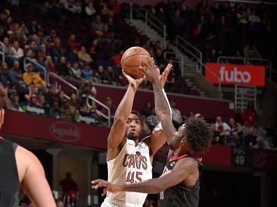 CLEVELAND, OH - DECEMBER 18: Donovan Mitchell #45 of the Cleveland Cavaliers shoots a three point basket against the Houston Rockets on December 18, 2023 at Rocket Mortgage FieldHouse in Cleveland, Ohio. NOTE TO USER: User expressly acknowledges and agrees that, by downloading and/or using this Photograph, user is consenting to the terms and conditions of the Getty Images License Agreement. Mandatory Copyright Notice: Copyright 2023 NBAE (Photo by David Liam Kyle/NBAE via Getty Images)