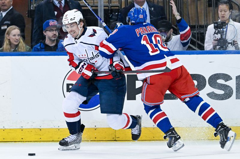 Apr 23, 2024; New York, New York, USA;  New York Rangers left wing Artemi Panarin (10) defends against Washington Capitals center Dylan Strome (17) during the second period in game two of the first round of the 2024 Stanley Cup Playoffs at Madison Square Garden. Mandatory Credit: Dennis Schneidler-USA TODAY Sports