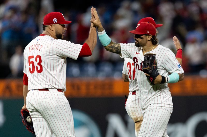 Sep 11, 2024; Philadelphia, Pennsylvania, USA; Philadelphia Phillies outfielder Nick Castellanos (8) high fives pitcher Carlos Estevez (53) after a victory against the Tampa Bay Rays at Citizens Bank Park. Mandatory Credit: Bill Streicher-Imagn Images