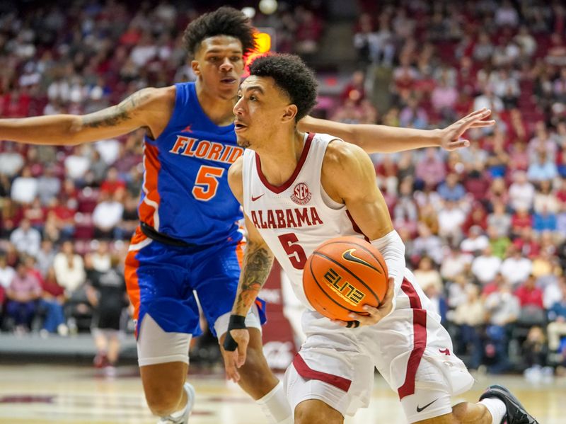 Feb 8, 2023; Tuscaloosa, Alabama, USA; Alabama Crimson Tide guard Jahvon Quinerly (5) drives to the basket against Florida Gators guard Will Richard (5) during the second half at Coleman Coliseum. Mandatory Credit: Marvin Gentry-USA TODAY Sports