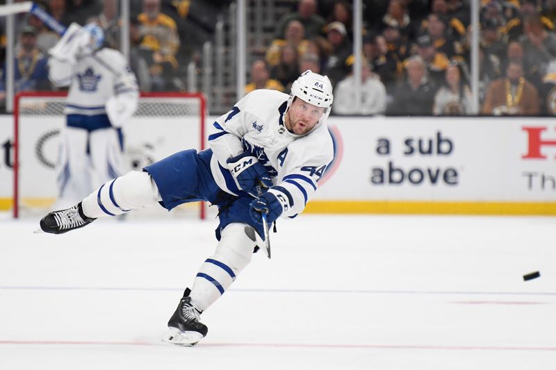 Apr 30, 2024; Boston, Massachusetts, USA; Toronto Maple Leafs defenseman Morgan Rielly (44) shoots the puck during the second period in game five of the first round of the 2024 Stanley Cup Playoffs against the Boston Bruins at TD Garden. Mandatory Credit: Bob DeChiara-USA TODAY Sports