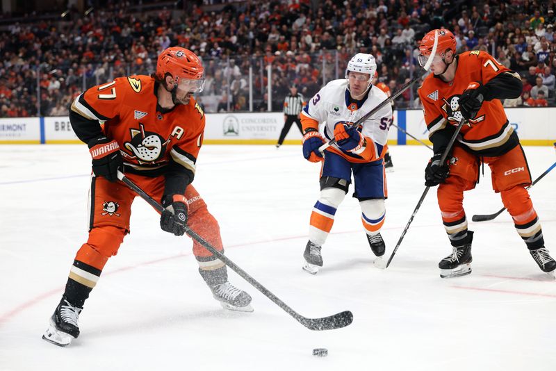 Mar 4, 2026; Anaheim, California, USA;  Anaheim Ducks left wing Alex Killorn (17) controls the puck against New York Islanders center Casey Cizikas (53) during the second period at Honda Center. Mandatory Credit: Kiyoshi Mio-Imagn Images