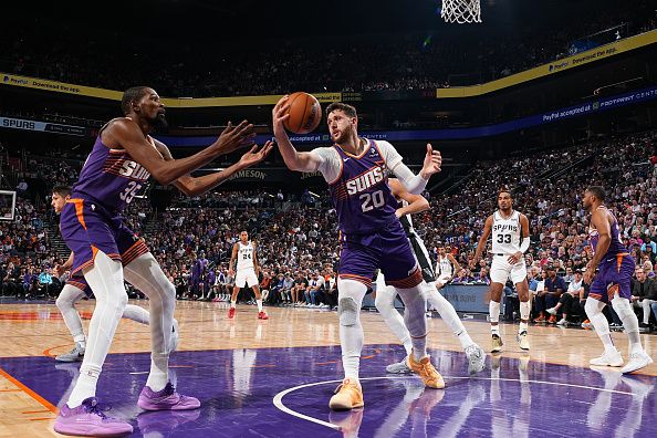 PHOENIX, AZ - NOVEMBER 2: Jusuf Nurkic #20 of the Phoenix Suns rebounds the ball during the game against the San Antonio Spurs on November 2, 2023 at Footprint Center in Phoenix, Arizona. NOTE TO USER: User expressly acknowledges and agrees that, by downloading and or using this photograph, user is consenting to the terms and conditions of the Getty Images License Agreement. Mandatory Copyright Notice: Copyright 2023 NBAE (Photo by Garrett Ellwood/NBAE via Getty Images)