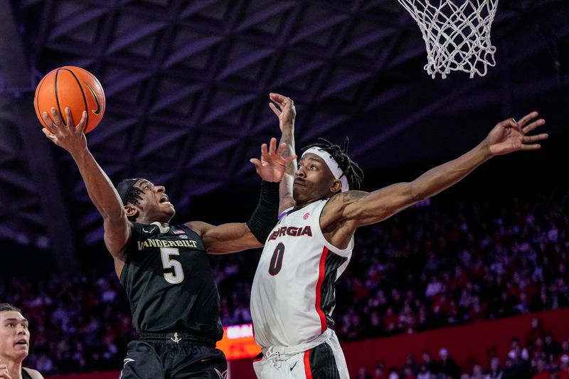 Jan 21, 2023; Athens, Georgia, USA; Vanderbilt Commodores guard Ezra Manjon (5) shoots over Georgia Bulldogs guard Terry Roberts (0) during the first half at Stegeman Coliseum. Mandatory Credit: Dale Zanine-USA TODAY Sports