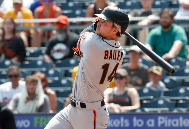 Jul 16, 2023; Pittsburgh, Pennsylvania, USA;  San Francisco Giants catcher Patrick Bailey (14) hits a two run double against the Pittsburgh Pirates during the tenth inning at PNC Park. Mandatory Credit: Charles LeClaire-USA TODAY Sports