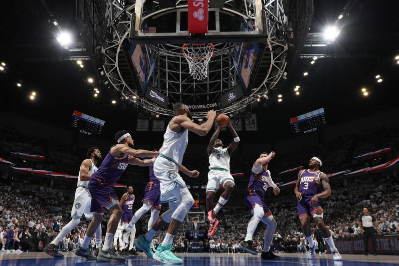 MINNEAPOLIS, MN -  APRIL 20: Anthony Edwards #5 of the Minnesota Timberwolves shoots the ball during Round One Game One of the 2024 NBA Playoffs against the Phoenix Suns on April 20, 2024 at Target Center in Minneapolis, Minnesota. NOTE TO USER: User expressly acknowledges and agrees that, by downloading and or using this Photograph, user is consenting to the terms and conditions of the Getty Images License Agreement. Mandatory Copyright Notice: Copyright 2024 NBAE (Photo by Jordan Johnson/NBAE via Getty Images)