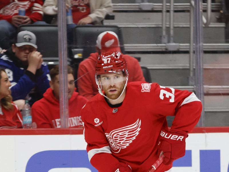 Oct 17, 2025; Detroit, Michigan, USA; Detroit Red Wings left wing J.T. Compher (37) handles the puck during the first period against the Tampa Bay Lightning at Little Caesars Arena. Mandatory Credit: Brian Bradshaw Sevald-Imagn Images