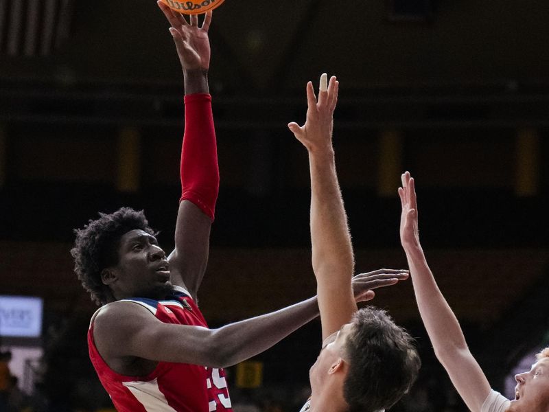 Jan 31, 2023; Laramie, Wyoming, USA; Fresno State Bulldogs center Eduardo Andre (35) shoots against Wyoming Cowboys forward Hunter Thompson (10) during the first half at Arena-Auditorium. Mandatory Credit: Troy Babbitt-USA TODAY Sports