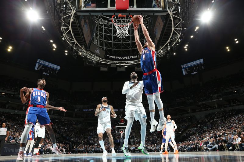 MINNEAPOLIS, MN -  NOVEMBER 27: Domantas Sabonis #11 of the Sacramento Kings dunks the ball during the game against the Minnesota Timberwolves on November 27, 2024 at Target Center in Minneapolis, Minnesota. NOTE TO USER: User expressly acknowledges and agrees that, by downloading and or using this Photograph, user is consenting to the terms and conditions of the Getty Images License Agreement. Mandatory Copyright Notice: Copyright 2024 NBAE (Photo by David Sherman/NBAE via Getty Images)