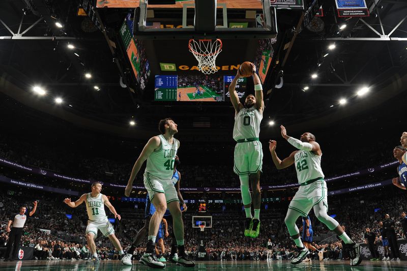 BOSTON, MA - JANUARY 17: Jayson Tatum #0 of the Boston Celtics rebounds the ball during the game against the Orlando Magic on January 17, 2025 at TD Garden in Boston, Massachusetts. NOTE TO USER: User expressly acknowledges and agrees that, by downloading and/or using this Photograph, user is consenting to the terms and conditions of the Getty Images License Agreement. Mandatory Copyright Notice: Copyright 2025 NBAE (Photo by Brian Babineau/NBAE via Getty Images)