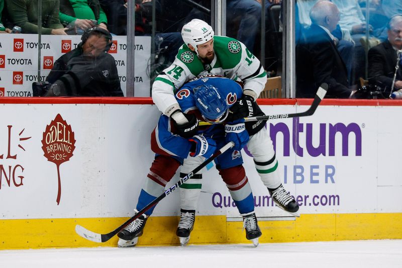 May 13, 2024; Denver, Colorado, USA; Colorado Avalanche defenseman Cale Makar (8) gets help up by Dallas Stars left wing Jamie Benn (14) in the second period in game four of the second round of the 2024 Stanley Cup Playoffs at Ball Arena. Mandatory Credit: Isaiah J. Downing-USA TODAY Sports