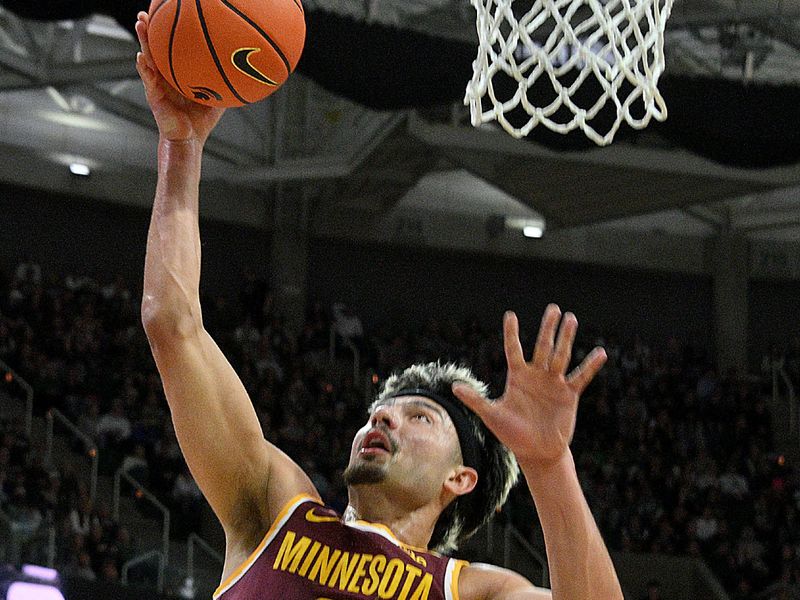 Jan 28, 2025; East Lansing, Michigan, USA;  Minnesota Golden Gophers forward Dawson Garcia (3) scores against the Michigan State Spartans during the first half at Jack Breslin Student Events Center. Mandatory Credit: Dale Young-Imagn Images