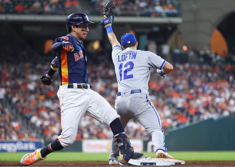 Sep 24, 2023; Houston, Texas, USA; Houston Astros center fielder Mauricio Dubon (14) is out at first base as Kansas City Royals first baseman Nick Loftin (12) fields a throw on a play during the third inning at Minute Maid Park. Mandatory Credit: Troy Taormina-USA TODAY Sports