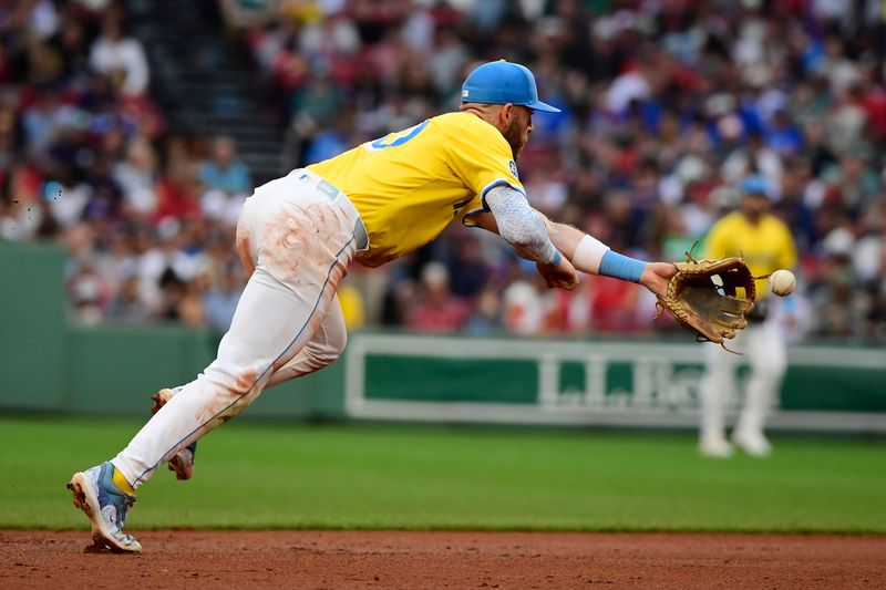 Jun 28, 2025; Boston, Massachusetts, USA; Boston Red Sox shortstop Trevor Story (10) tosses the ball to second base for a force out during the seventh inning against the Toronto Blue Jays at Fenway Park. Mandatory Credit: Bob DeChiara-Imagn Images