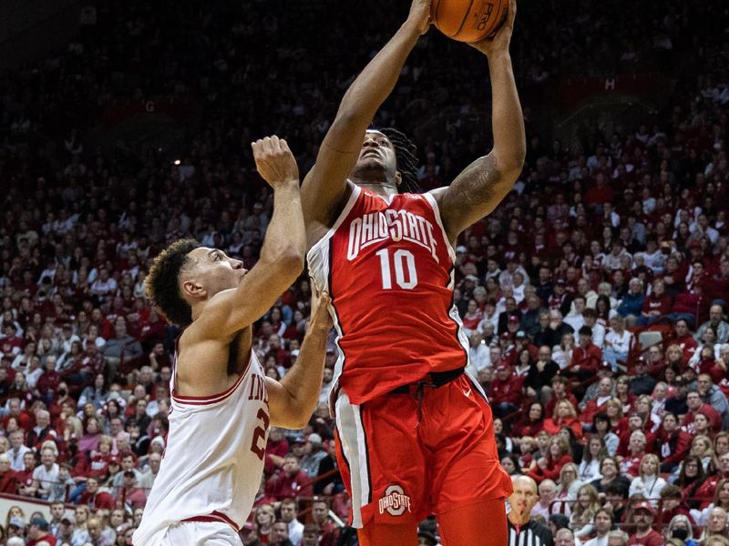 Jan 28, 2023; Bloomington, Indiana, USA; Ohio State Buckeyes forward Brice Sensabaugh (10) shoots the ball while Indiana Hoosiers forward Trayce Jackson-Davis (23) defends in the second half  at Simon Skjodt Assembly Hall. Mandatory Credit: Trevor Ruszkowski-USA TODAY Sports