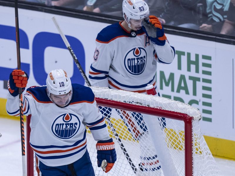 Dec 30, 2022; Seattle, Washington, USA; Edmonton Oilers forward Derek Ryan (10) celebrates after scoring a goal against the Seattle Kraken during the second period at Climate Pledge Arena. Mandatory Credit: Stephen Brashear-USA TODAY Sports