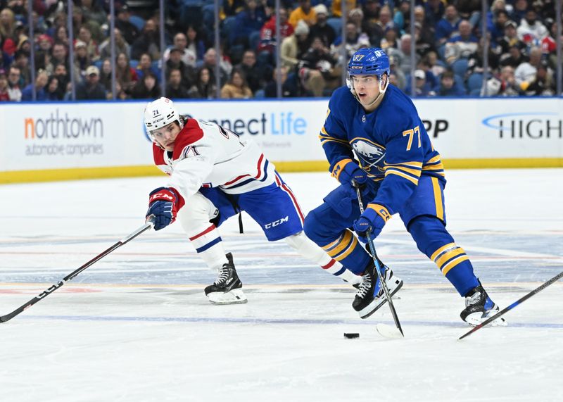 Nov 11, 2024; Buffalo, New York, USA; Buffalo Sabres right wing JJ Peterka (77) handles the puck as Montreal Canadiens center Jake Evans (71) gives chase in the second period at KeyBank Center. Mandatory Credit: Mark Konezny-Imagn Images