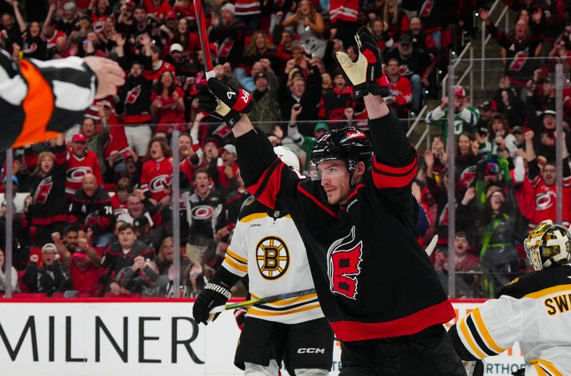 Oct 31, 2024; Raleigh, North Carolina, USA;  Carolina Hurricanes right wing Andrei Svechnikov (37) celebrates his goal against the Boston Bruins during the first period at Lenovo Center. Mandatory Credit: James Guillory-Imagn Images