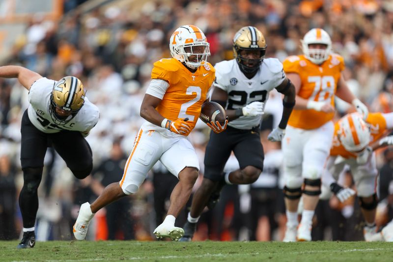 Nov 25, 2023; Knoxville, Tennessee, USA; Tennessee Volunteers running back Jabari Small (2) runs the ball against the Vanderbilt Commodores during the first half at Neyland Stadium. Mandatory Credit: Randy Sartin-USA TODAY Sports