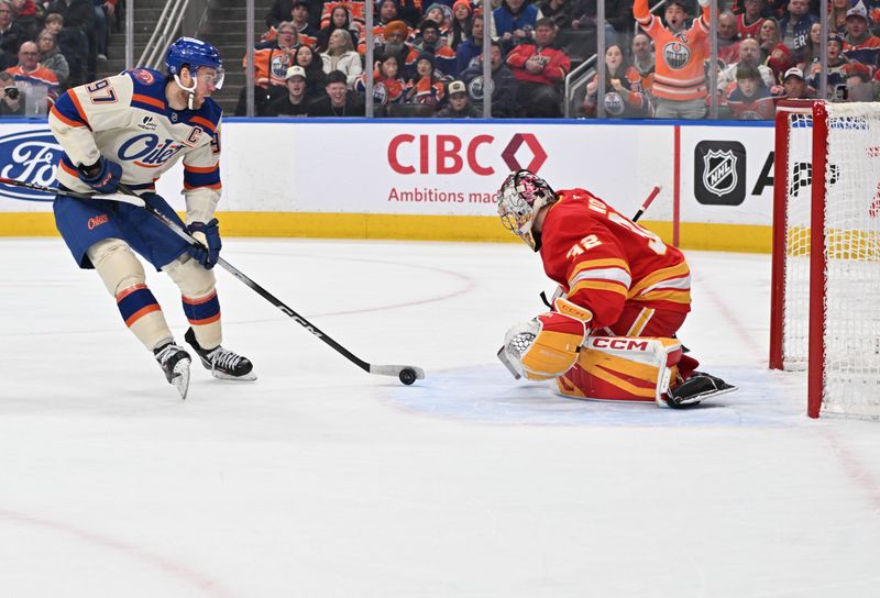 Dec 23, 2025; Edmonton, Alberta, CAN; Edmonton Oilers center Connor McDavid (97) goes in for a shot on Calgary Flames goalie Dustin Wolf (32) during the first period at Rogers Place. Mandatory Credit: Walter Tychnowicz-Imagn Images