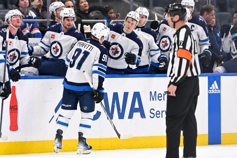 Mar 23, 2024; Elmont, New York, USA;  Winnipeg Jets center Cole Perfetti (91) celebrates his goal against the New York Islanders during the third period at UBS Arena. Mandatory Credit: Dennis Schneidler-USA TODAY Sports