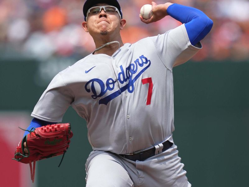 Jul 19, 2023; Baltimore, Maryland, USA; Los Angeles Dodgers pitcher Julio Urias (7) delivers in the first inning against the Baltimore Orioles at Oriole Park at Camden Yards. Mandatory Credit: Mitch Stringer-USA TODAY Sports