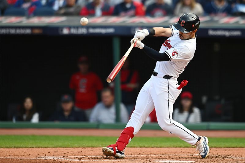 Oct 12, 2024; Cleveland, Ohio, USA; Cleveland Guardians outfielder Steven Kwan (38) hits a double in the third inning against the Detroit Tigers during game five of the ALDS for the 2024 MLB Playoffs at Progressive Field. Mandatory Credit: Ken Blaze-Imagn Images