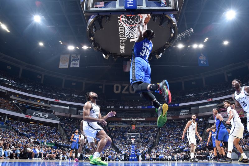 ORLANDO, FL - OCTOBER 25: Wendell Carter Jr. #34 of the Orlando Magic drives to the basket during the game against the Brooklyn Nets on October 25, 2024 at Kia Center in Orlando, Florida. NOTE TO USER: User expressly acknowledges and agrees that, by downloading and or using this photograph, User is consenting to the terms and conditions of the Getty Images License Agreement. Mandatory Copyright Notice: Copyright 2024 NBAE (Photo by Fernando Medina/NBAE via Getty Images)