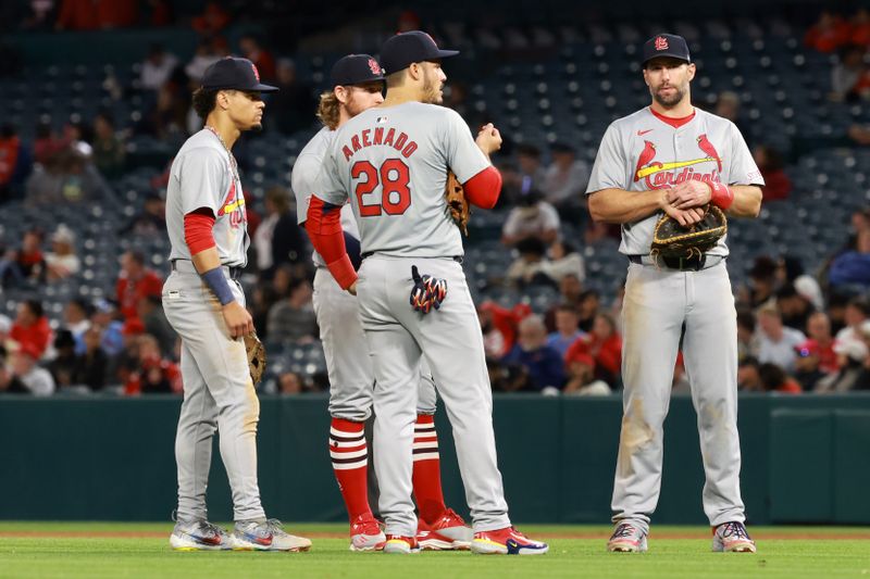 May 15, 2024; Anaheim, California, USA;  St. Louis Cardinals shortstop Masyn Winn (0) and second baseman Brendan Donovan (33) and third baseman Nolan Arenado (28) and first baseman Paul Goldschmidt (46) chat during a pitching change in the seventh inning against the Los Angeles Angels at Angel Stadium. Mandatory Credit: Kiyoshi Mio-USA TODAY Sports